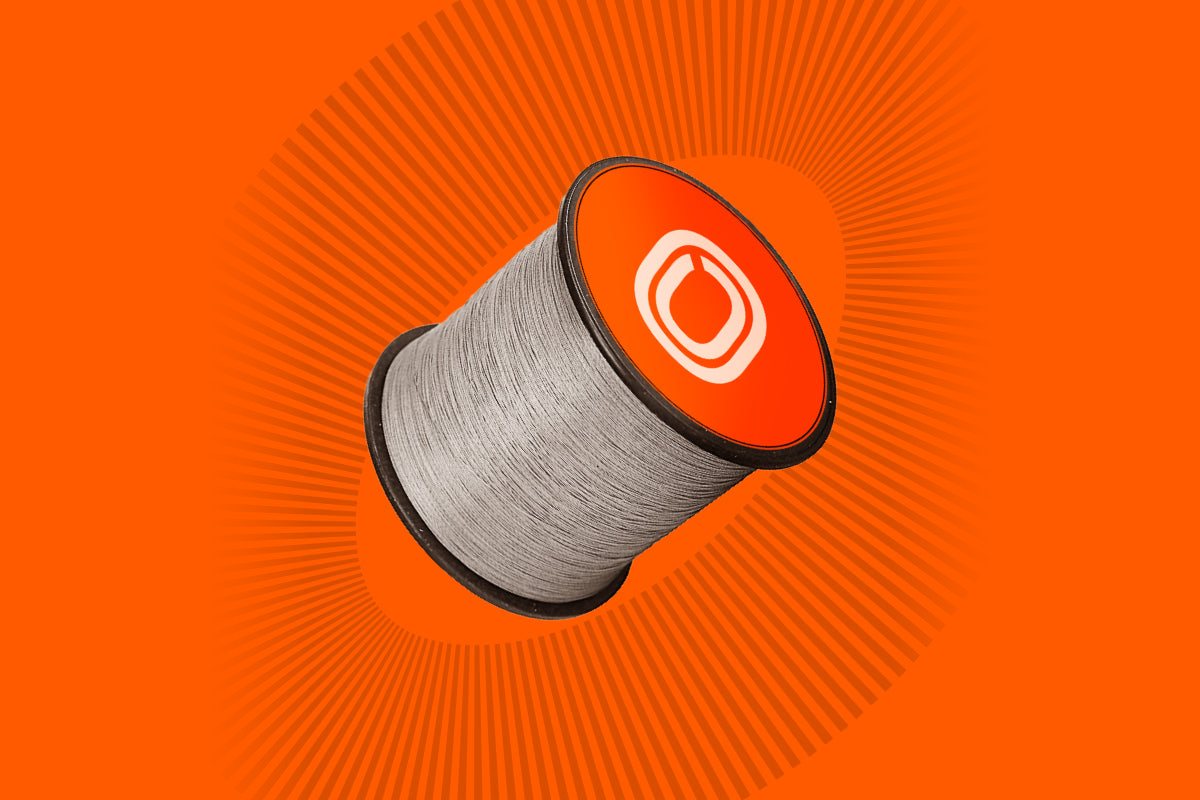 Spool of braided fishing line on an orange Obalus background