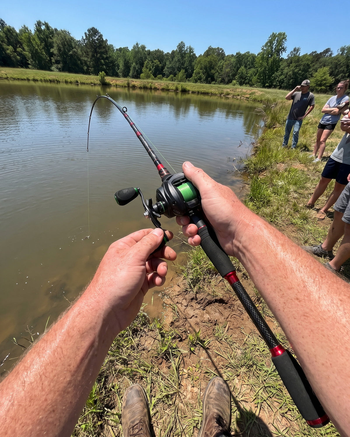 ProFishient casting rod bent with a fish on, seen from the angler’s point of view