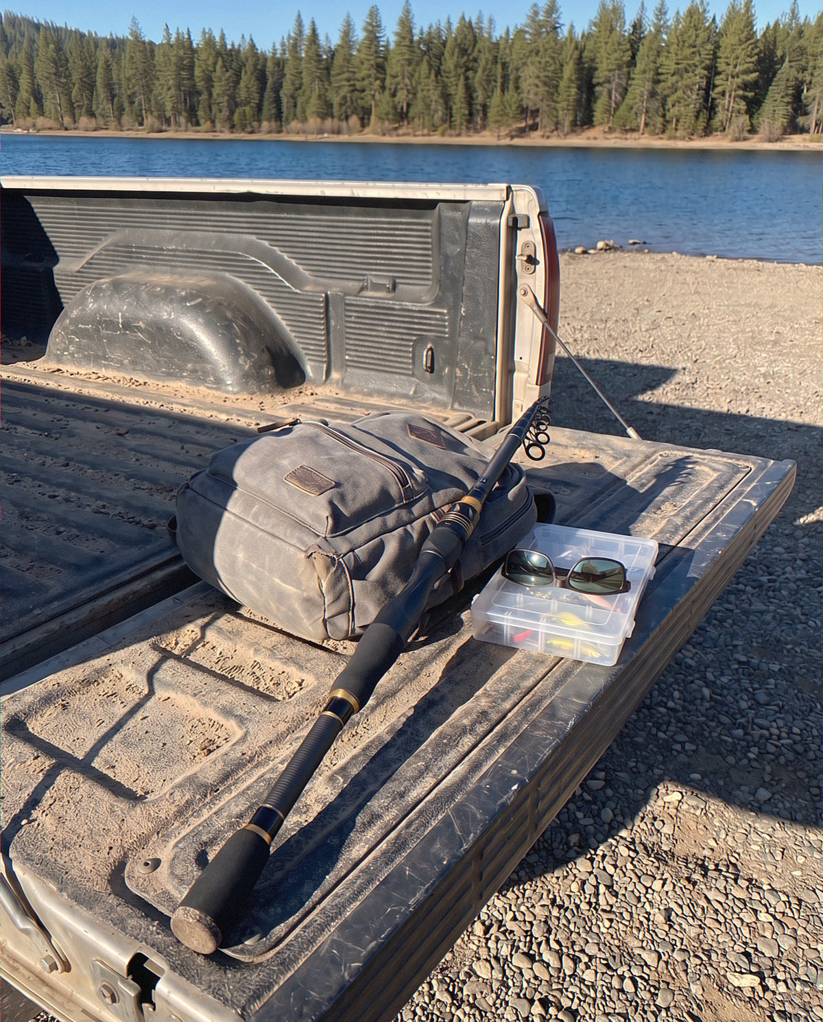 The Carbon Storm rod collapsed to 24 inches on a truck tailgate next to a backpack