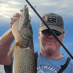 An Obalus owner holding up a fish